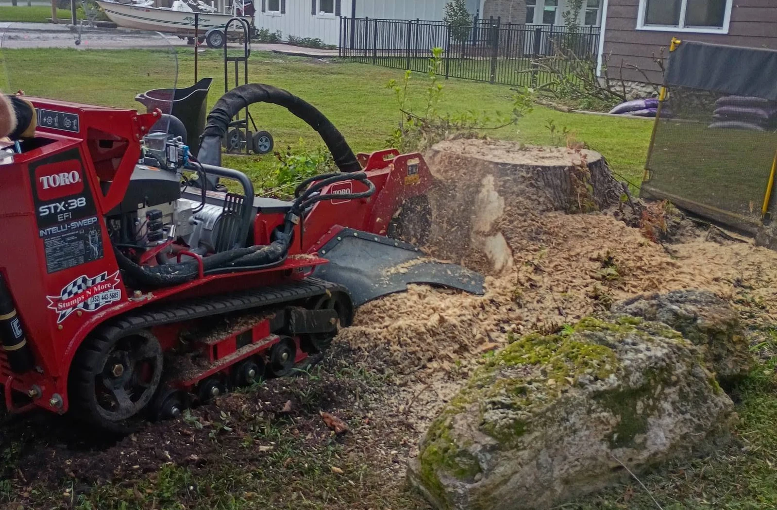 Stumps N More grinding a large stump